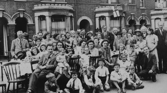 Black and white photograph of civilians gathered in a street - from Pixabay https://www.pexels.com/photo/a-grayscale-photo-of-people-on-the-street-9015673/