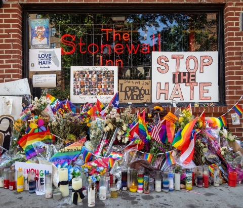 Stonewall memorial, from Wikimedia Commons -https://commons.wikimedia.org/wiki/File:Stonewall_Inn_with_Orlando_nightclub_shooting_memorial_during_Pride_2016_(50126p).jpg