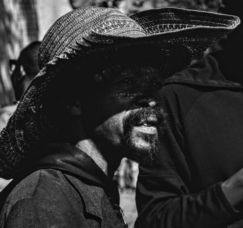 Black African man photographed in Southern Africa.  Black and white photograph.