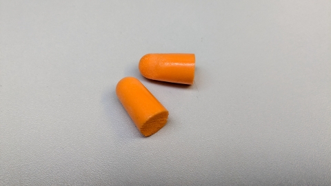 Orange sound cancelling earplugs