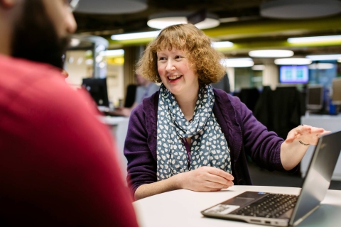 Faculty Librarian demonstrating a resource to a student