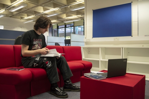Student in the Postgraduate Study Suite breakout area