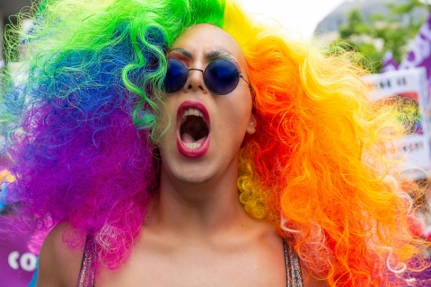 Woman with rainbow-striped hair shouting, from Pexels - https://www.pexels.com/photo/woman-opening-her-mouth-2336840/