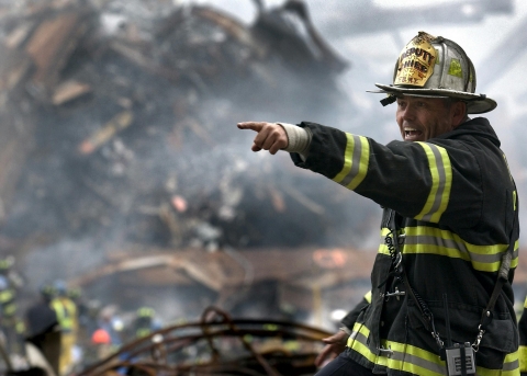 Fireman pointing and shouting at a disaster site