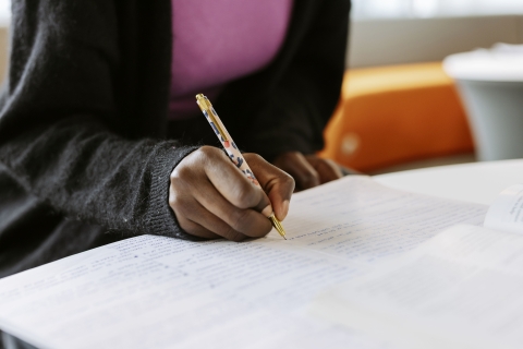 Black woman making notes
