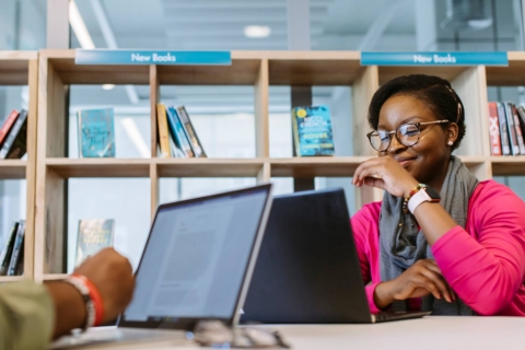 Student on a laptop in library 