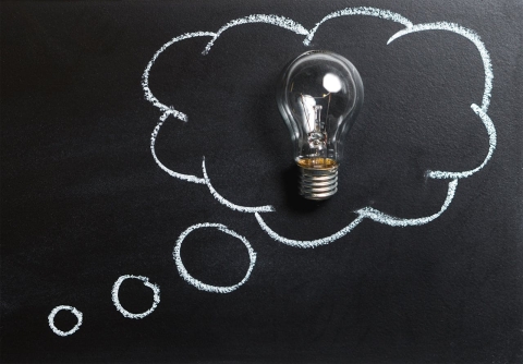 Lightbulb in a thought bubble. From Pexels - https://www.pexels.com/photo/clear-light-bulb-placed-on-chalkboard-355952/