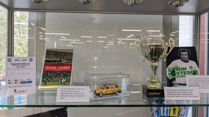 Book, cup and model car