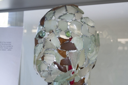 Human head created from fragments of broken glass soldered together