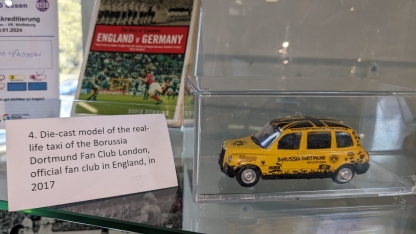 Die-cast model of the real-life taxi of the Borussia Dortmund Fan Club London, official fan club in England, in 2017