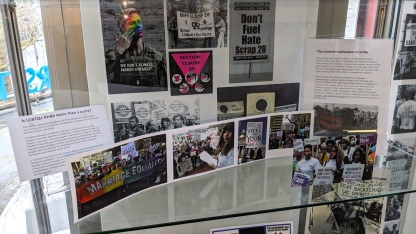 Display of LGBTQ_ posters and photographs.  Text panels are titled: Is LGBTQ+ Pride more than a party, The commercialisation of pride