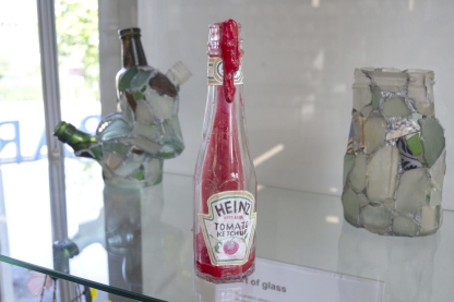 Ketchup bottle overflowing with red resin
