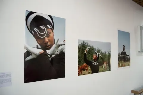 Perspective over perception - image of African woman in traditional dress standing on the African savannah - by Coltart Sithole (@col_shots)