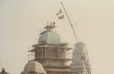 Galleon weather vane being lifted onto Park building 