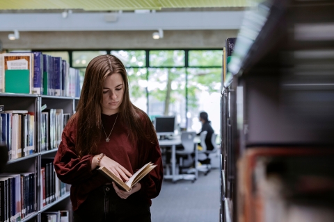B-roll Day one - selecting and reading book in the library