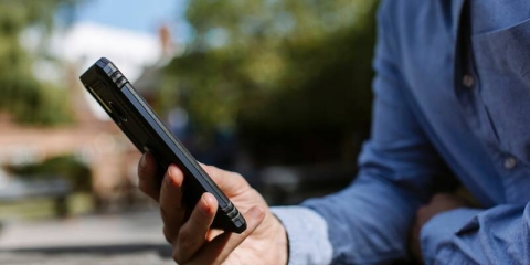 Person texting on a mobile phone