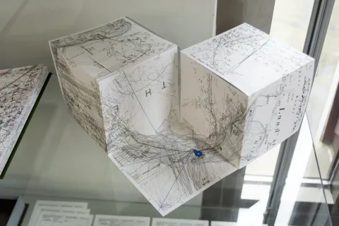 Map folded into two connected cubes