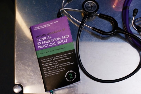clinical health book and stethoscope