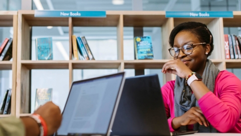 Student on a laptop in library 